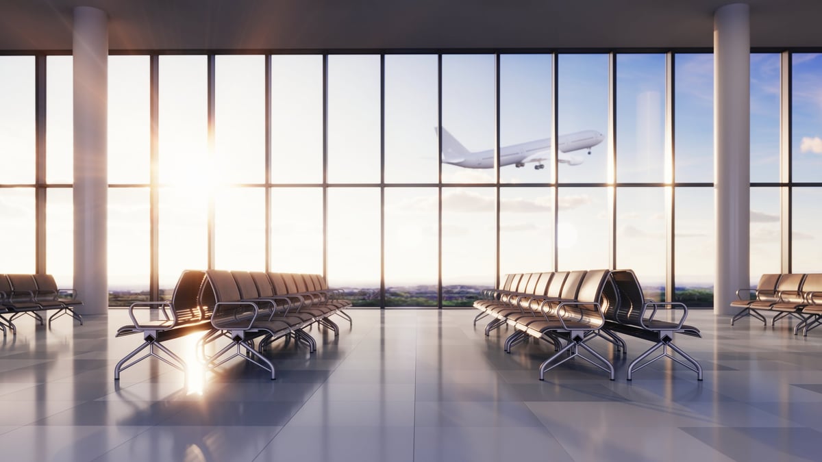 Airport terminal with an aircraft visible beyond the window